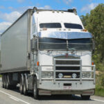 Truck prime mover driving down road in Australia