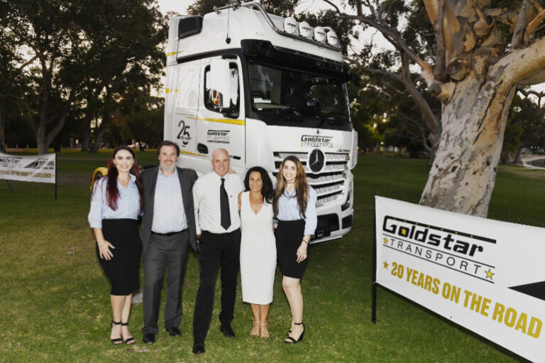 Goldstar Transport management team with fleet truck