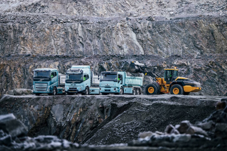 trucks and loader in quarry