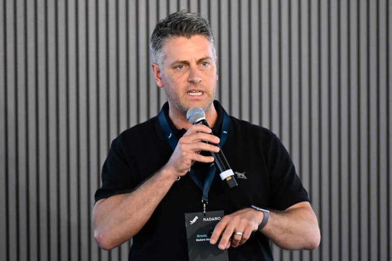 Radaro uses HERE Technologies to improve last-mile delivery MELBOURNE, AUSTRALIA - MARCH 05: Brenton Gill, Co-Founder and CEO, Radaro addresses the crowd during the HERE Technologies conference in the Chicane Pavilion at Albert Park Grand Prix Circuit on March 05, 2026 in Melbourne, Australia. (Photo by Adam Trafford/Getty Images for HERE Technologies)